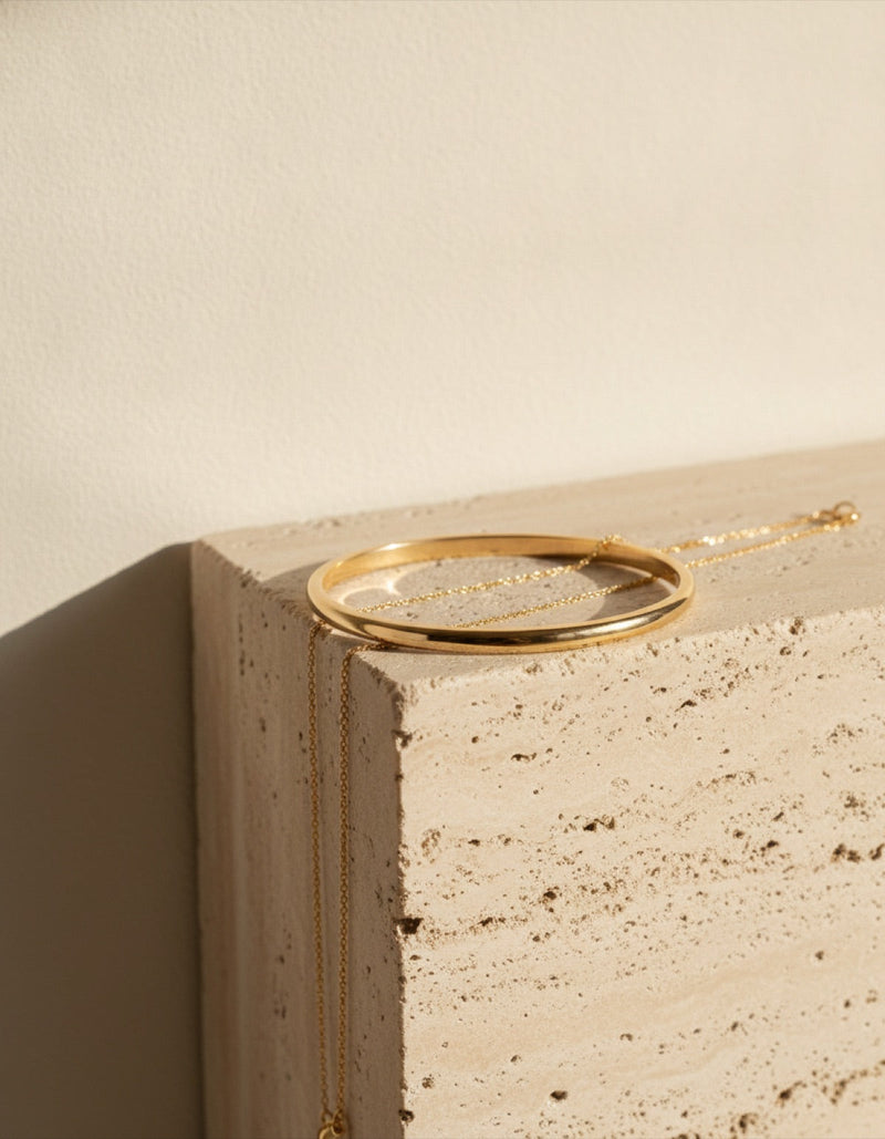 Fine gold jewellery on stone at House of Brandz